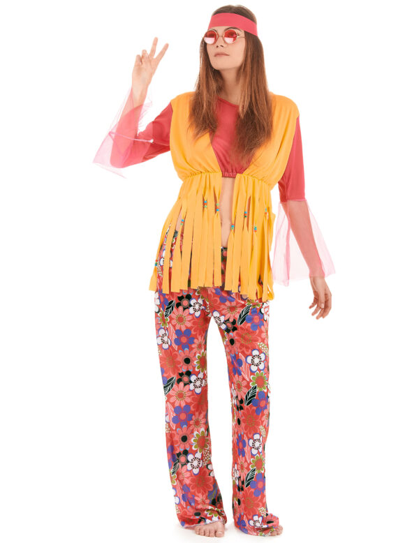 Déguisement de hippie pour femme, comprenant un tee-shirt rose court à manches évasées en résille, un gilet jaune à longues franges perlées, un pantalon élastique à motifs Flower Power et un bandeau rose, idéal pour les soirées à thème années 60/70, Carnaval et les festivals.