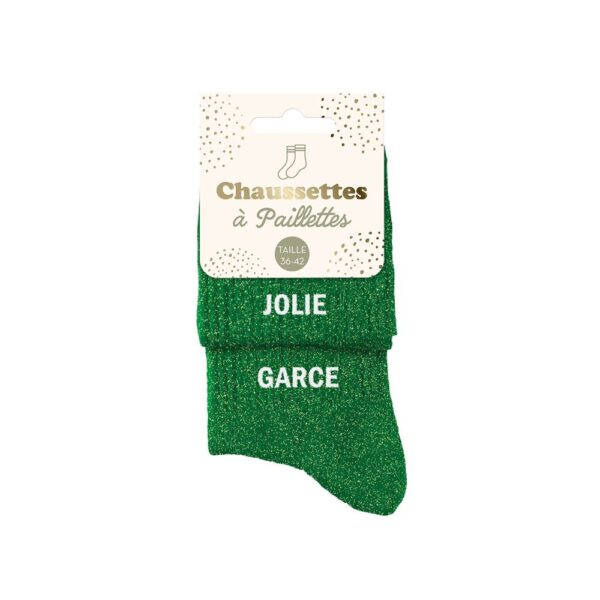 chaussettes dépareillées vertes à paillettes avec les mentions "Jolie" et "Garce" en blanc