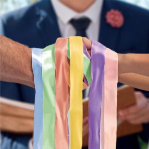 RITUEL DES RUBANS MARIAGE. Pour célébrer une union de manière originale et colorée, nous vous proposons notre jeu du rituel des rubans. Le marié et la mariée se tiennent les mains entourées de rubans de différentes couleurs. Le ruban qu'ils tireront donnera alors la couleur de leur union. Les rubans colorés indiquent : Jaune = Joie / Vert = Santé / Sincérité = Bleu / Violet = Puissance / Rose = Bonheur / Saumon = Bonté / Rouge = Passion / Marron = Maison / Blanc = Pureté / Gris Foncé = Équilibre / Noir = Sagesse / Gris = Créativité / Doré = Richesse.