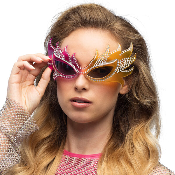 Lunettes party Extravaganza Attirez l'attention avec ces lunettes de fête fantaisie uniques, décorées de strass étincelants et d'un design coloré accrocheur. Un accessoire parfait pour une fête costumée, une mauvaise fête ou un carnaval.