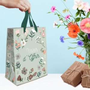 Sublimez vos petites attentions avec notre pochette "Plaisir d'Offrir" Floral MM. Son design élégant sur un fond vert de gris, orné de motifs floraux délicats et de la mention "Plaisir d'Offrir !" en vert et gris, apportera une touche de charme naturel et de chaleur à vos présents