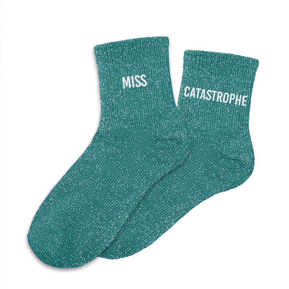 Pour affirmer votre personnalité avec humour, ces chaussettes à paillettes "Miss Catastrophe" sont le choix idéal